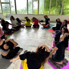 A partner yoga exercise during a retreat. These practices help build trust, communication, and a sense of connection within the group.