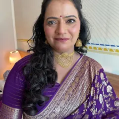 An unfiltered photo showing the final makeup look on mature skin. The skin looks hydrated, smooth, and radiant.