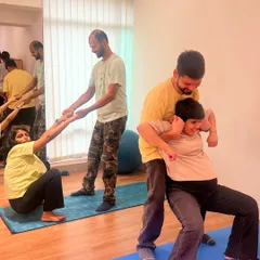 This is what we call the 'Birth Boss' pose. We empower moms to find positions of strength and comfort, with their partners providing physical and emotional support throughout.