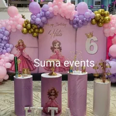 A grand Disney Princess setup for Hita's 6th birthday. This decoration features multiple princess cutouts, a castle-themed backdrop, and an elaborate balloon arrangement in shades of pink and purple.