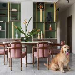 This pet-friendly dining area shows how I design spaces for the whole family, including furry members. The custom 'Pellet drum' dining table and 'Svelte' chairs create a sophisticated yet comfortable setting.