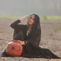 A shot from the "Dil Hoom Hoom Kare" series, featuring my black lehenga. The simplicity of the outfit is contrasted with the dramatic, arid landscape.