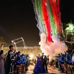 Your entry sets the tone for the entire night. For this couple, I designed a high-impact entrance with LED-clad dancers, colorful smoke, and perfectly timed pyrotechnics to create a truly electrifying start to their celebration.