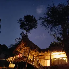 The beautiful mud house at night, offering a rustic and comfortable stay.