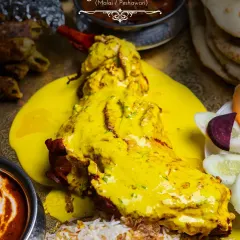 The star of the Akbari Thaal, our Mutton Raan, is presented here drenched in a rich Malai sauce. The meat is slow-cooked until it is exceptionally tender, falling right off the bone.