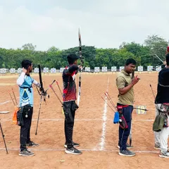 The shooting line at the Senior State Archery Competition in Kolhapur. Archers stand ready, demonstrating the discipline and focus required in a competitive setting.