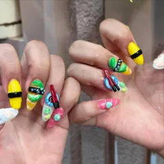 A close-up on the texture and detail of our 3D sushi nails. We use high-quality products to sculpt each element by hand, ensuring your nail art is a true masterpiece.