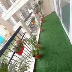 Another view of the finished balcony lawn, which is durable enough for furniture and foot traffic. The turf I use is safe for both children and pets.