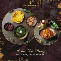 Lohri Da Rang with Punjabi flavors. This platter showcases a classic Punjabi meal of Sarson da Saag and Makki di Roti, served alongside paneer curry and other traditional accompaniments in authentic serveware.