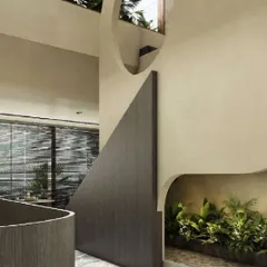 This villa transition zone embodies a zen-inspired tranquility. The fluidity of the curved walls is paired with a dry landscape bed, creating a sculptural and immersive experience where architecture and nature are in perfect harmony.