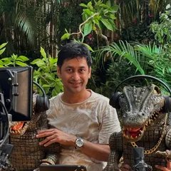 On the set of the Netflix promo, surrounded by cameras and equipment. My role involves not just creating the puppets but also performing with them to get the perfect shot.