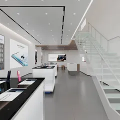 An interior view of a completed retail store in Hyderabad. The design includes a double-height space and a clean, white staircase, creating an open and inviting atmosphere for customers.