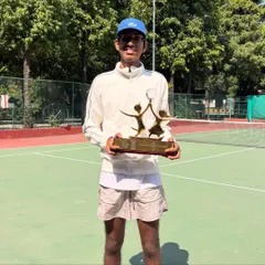 A full-length shot showing Lakshmi with his well-deserved Global Child Prodigy trophy. We work on building not just skill but also poise and confidence, preparing our athletes for success on and off the court.