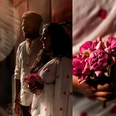 A romantic pre-wedding portrait with dramatic lighting. The couple stands close together, their profiles highlighted against a dark background.