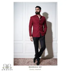 Make a powerful statement with our crimson red Bandhgala. The jacket is crafted from a richly textured fabric and tailored to perfection, creating a look of undeniable confidence. It's an ideal garment for a wedding or a cocktail event where you want to stand out.