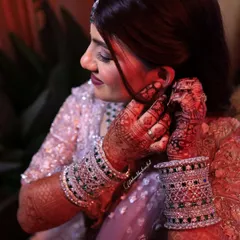Another shot of the bride, showing how the deep henna stain on her hands completes her entire bridal look.