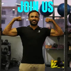 This is your invitation to join us. One of our trainers shows the results of dedication, welcoming you to become part of our strong and supportive family.