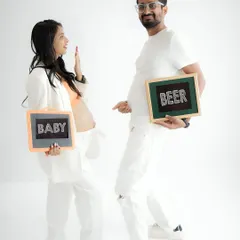 A little bit of humor for the journey. This playful shot with "Baby" and "Beer" signs is a fun way to capture your personalities and the changes ahead.