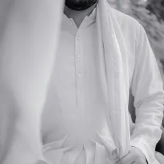 The quiet calm before the baraat. This black and white portrait of the groom, Manan, captures a moment of introspection and anticipation.