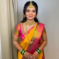 It's all in the eye makeup. For this stunning Shetty bride, I created a look with gorgeous nude shades and finely detailed eye makeup to complement her vibrant yellow and pink Kanjeevaram saree.
