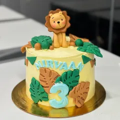 Another angle of the Nirvaan's jungle birthday cake, highlighting the custom details.