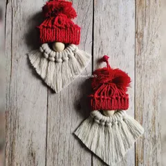How cute are these macrame gnomes? With their fluffy beards and little red hats, they are a fun and whimsical addition to your Christmas tree. These are eco-friendly and sustainable Christmas decorations.