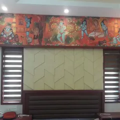 This bedroom features a unique combination of a traditional Indian mural above the headboard and modern 3D wall panels below. It's a creative way to blend cultural art with contemporary design.