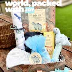 I call this one "A little dino world, packed with joy." This baby boy hamper brings a playful dinosaur theme to life with soft blue tones, a friendly dino rattle, and coordinated essentials, all presented in a beautiful marbled keepsake box.