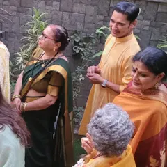 Sharing a moment with my student's family during the ceremony. The guru-shishya bond extends to the entire family, creating a beautiful community.