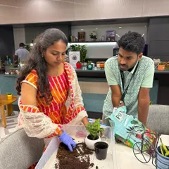 I guide you through the whole process. Here, I'm showing a new plant parent how to pot their chosen plant, ensuring it has the best start in its new home.