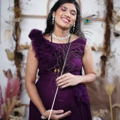 Planning a maternity photoshoot? This elegant purple ruffle gown is a popular choice. I can also help coordinate with makeup artists for a complete package.