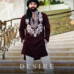 True style is about presence. I designed this deep maroon kurta with striking ivory embroidery on the neckline and cuffs to project an aura of quiet strength. Paired with classic trousers, it is a complete look of refined, masculine power for any celebration.