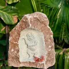 A niche carving of Bala Krishna, sculpted into a natural rock. Inspired by South Indian temple art, these pieces bring a sense of history and spirituality to your outdoor or indoor decor.