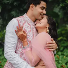 Celebrating the love that shines through in quiet moments. This tender embrace and forehead kiss beautifully capture the couple's affection and togetherness.