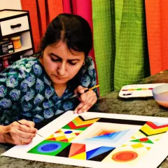 This student is creating a stunning geometric abstract piece inspired by the master S.H. Raza. My adult classes often explore famous art styles and techniques.