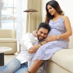 An intimate at-home session, capturing the husband-to-be listening to the baby's heartbeat. These moments, in the comfort of your own space, are truly precious.