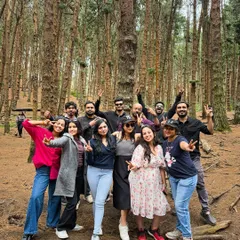 Our group having fun and posing for a photo in the middle of the dense pine forest in Kodaikanal.