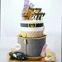 For the person who loves luxury, this two-tier cake is inspired by Gucci and Louis Vuitton. It features edible money, brand logos, and even a small sculpted car.
