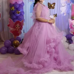 Get a matching queen and princess combo for your daughter's birthday. This lavender ruffle gown with a long tail for mom and a matching frock for the little one is a perfect fairytale set.
