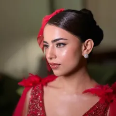 A close-up of the vintage-inspired glamour. The sharp winged liner, flawless skin, and perfectly defined lips are the key elements of this stunning look.