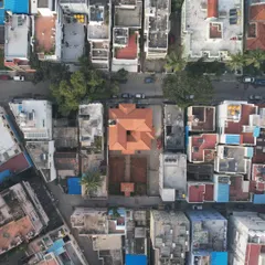 An aerial view of the Basavanagudi house, an oasis of traditional design amidst the concrete jungle of Bangalore. The Mangalore tile roof and central courtyard stand out, bringing a piece of heritage back to the urban landscape.