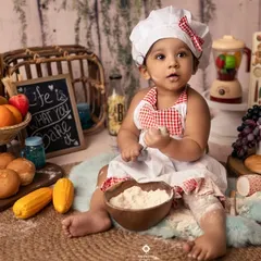 Freshly baked and cuter than a cupcake! This little chef is getting her hands messy with some flour, creating the most adorable and authentic moments during her baking-themed session.