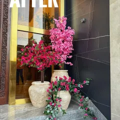 This is the 'after' shot, showing the complete transformation. I used a mix of faux bougainvillea and cherry blossom trees to create a layered, colorful, and grand display.