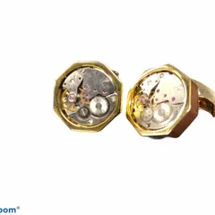 For the mechanically inclined, these unique cufflinks feature genuine, non-functional watch movements set in an octagonal gold-tone case. They are a celebration of intricate engineering and classic style.