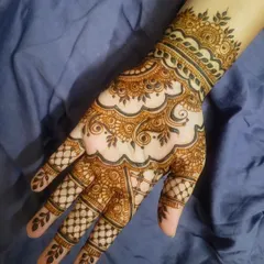 A beautiful henna design perfect for Eid or any celebration. The pattern flows gracefully from the wrist to the fingers, with a mix of paisleys and floral elements.