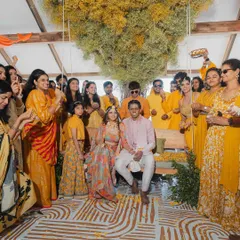For Aditya and Supreetha's Haldi, we curated a Bali-inspired theme overlooking the stunning Banasura lake. The highlight was this popular Bali swing, set under a mighty tree we crafted from baby's breath, creating a picture-perfect spot for the couple.