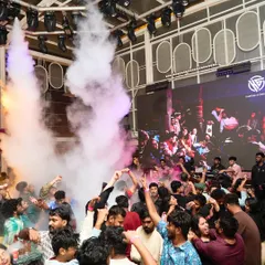 The moment the CO2 cannons erupt over the crowd. It's a full sensory experience designed to elevate the energy and make the night feel like a festival.