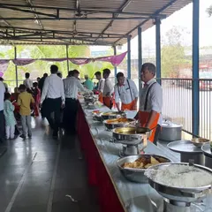 This is our buffet setup in full swing at a large wedding event. We ensure there is plenty of food and our staff is always present to manage the service.