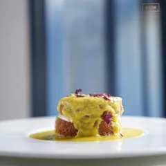 The plated Shahi Tukda, with saffron rabri cascading over the crispy bread. It’s a royal dessert, reimagined for the modern palate.