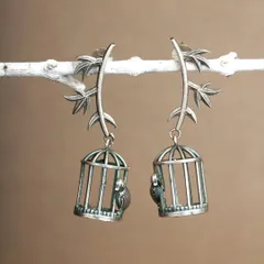 Birds are good outside the cage, and earrings should be lightweight. These unique silver-toned earrings carry a beautiful theme and are crafted to be comfortable.